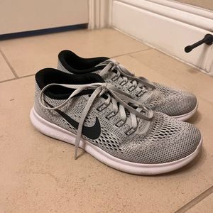 Women’s gray Nike running shoes